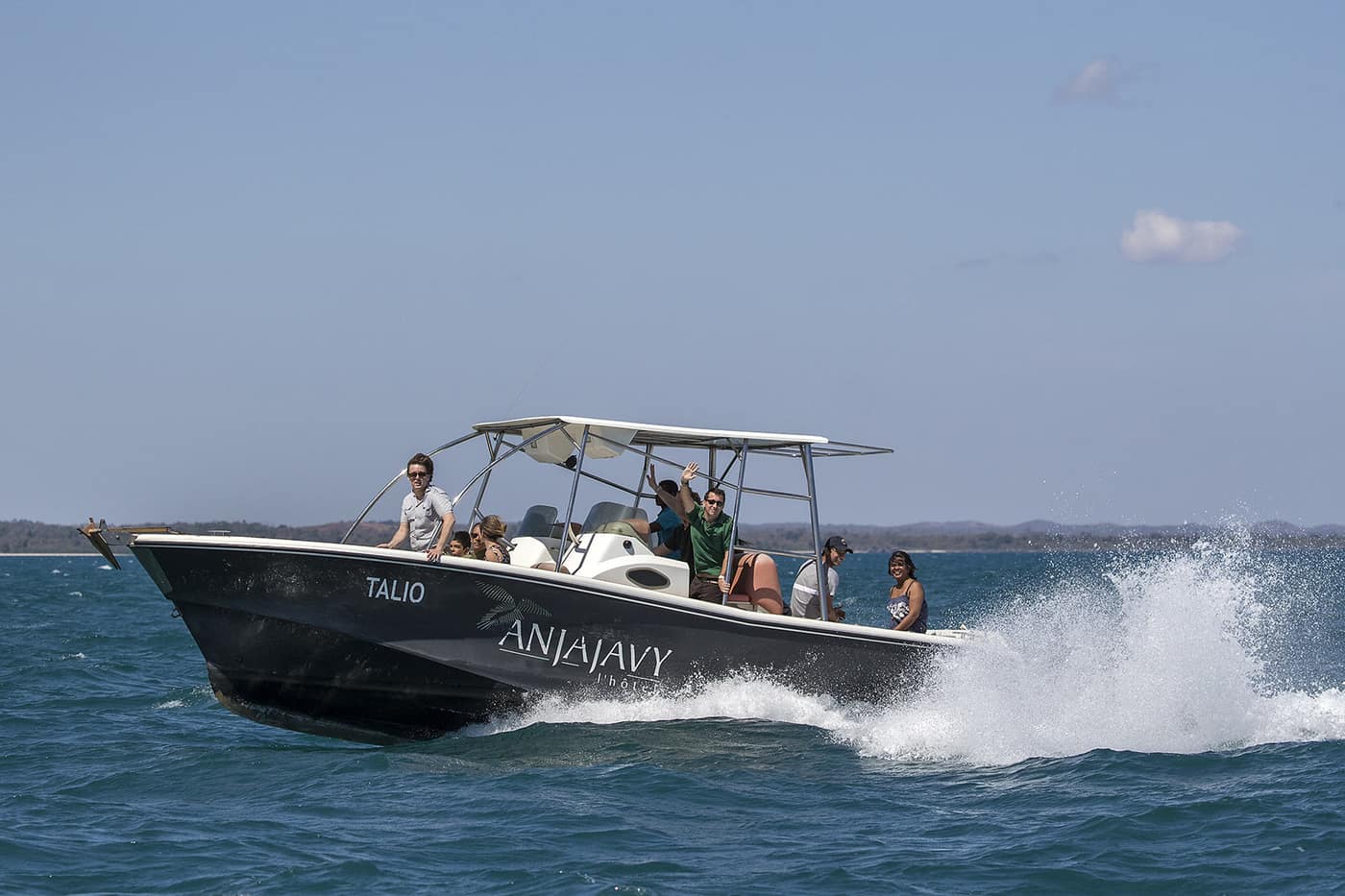 The Anjajavy boat speeding across the sea, with travellers on board