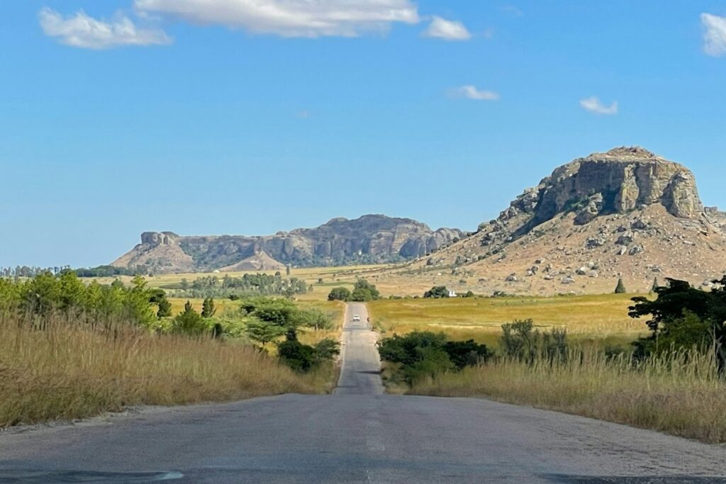 Dirt track under a blue dry-season sky