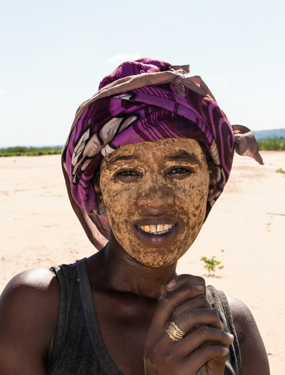Smiling Sakalava woman, her face adorned with masonjoany, on the banks of the Tsiribihina